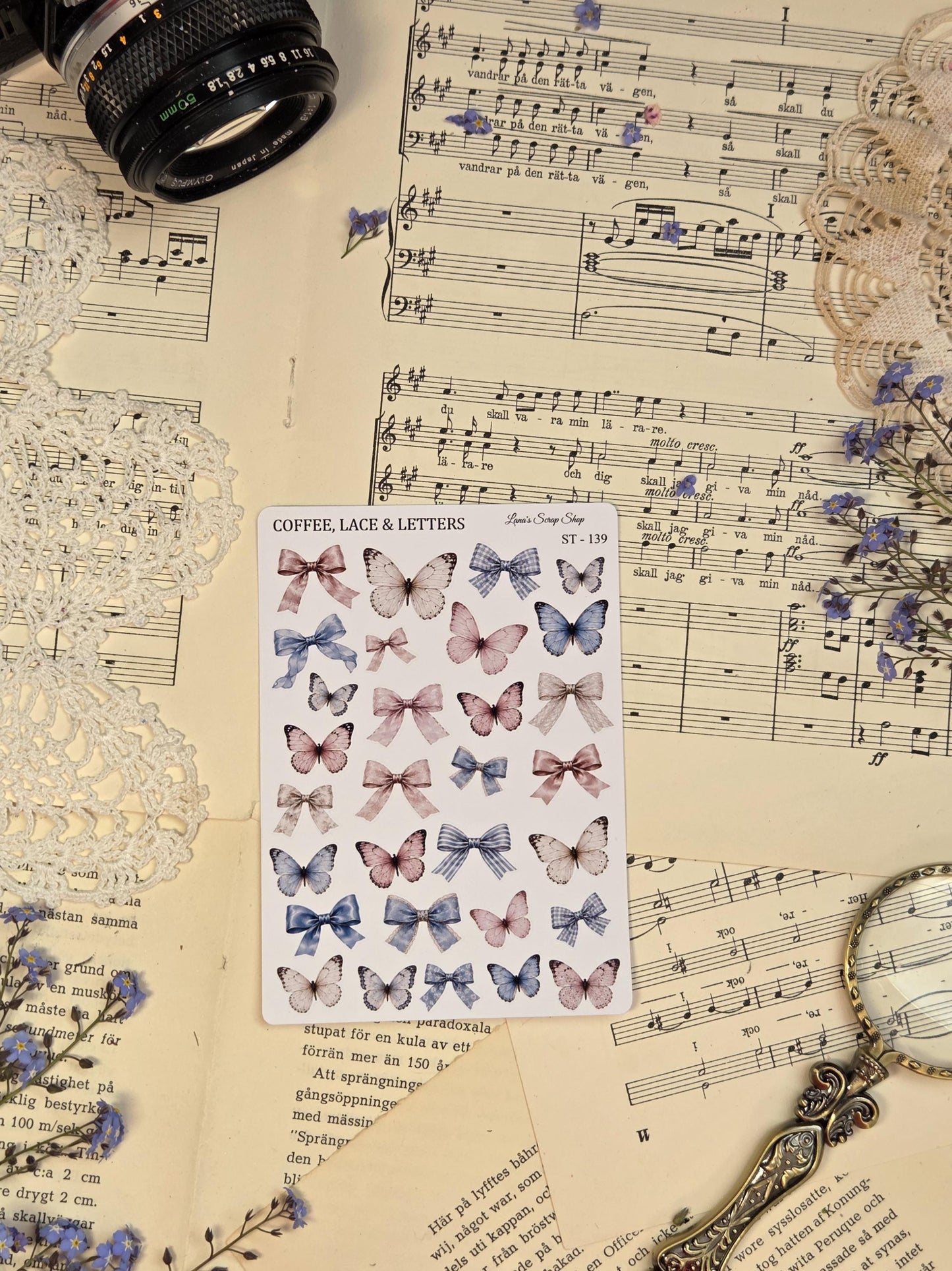 Romantic butterfly and bow sticker sheet with delicate pastel butterflies, lace bows, and vintage feminine details for planners and scrapbook spreads.