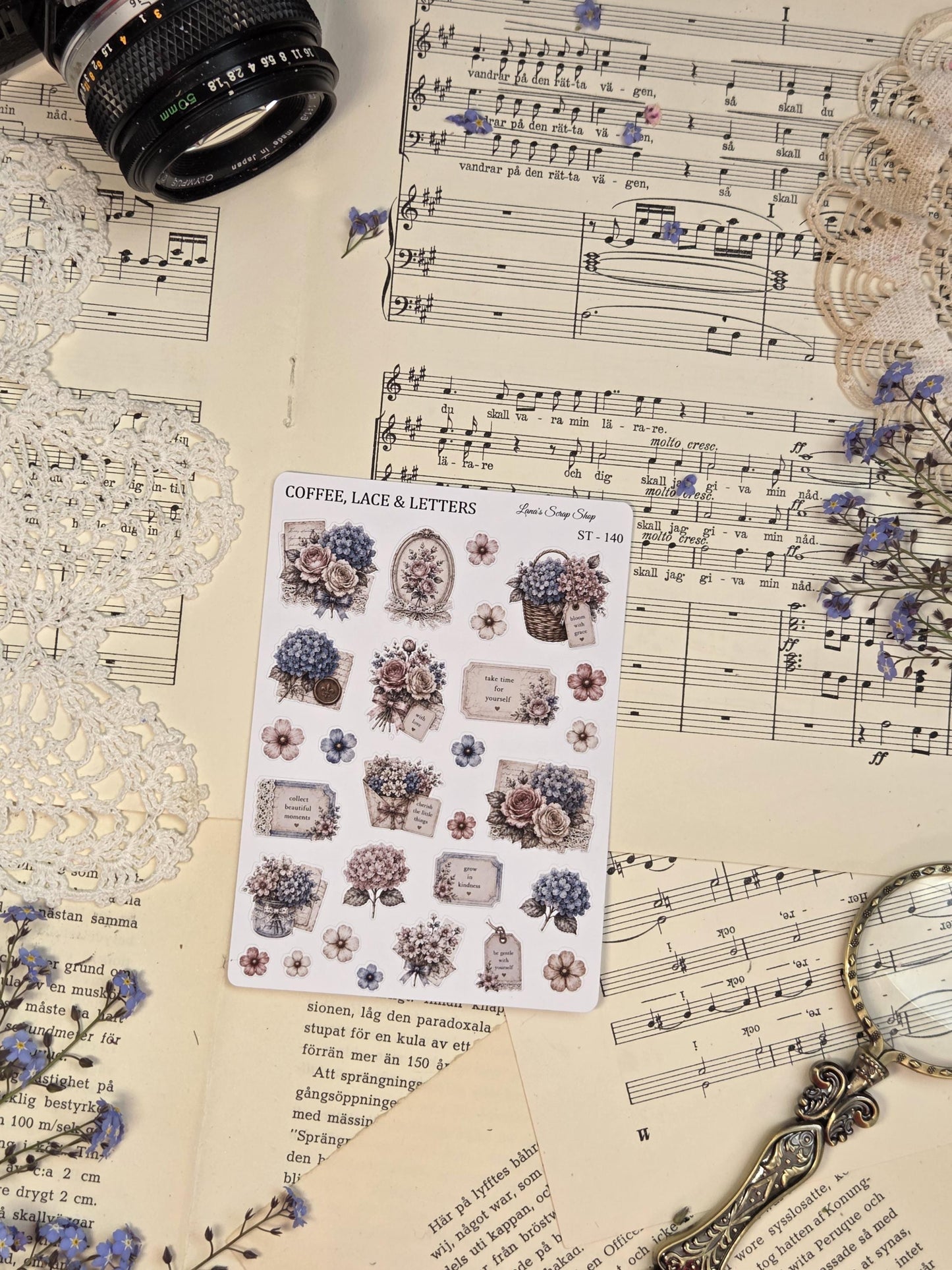 Vintage floral collage stickers with hydrangeas, roses, labels, and romantic cottagecore details in soft dusty blue and cream tones.