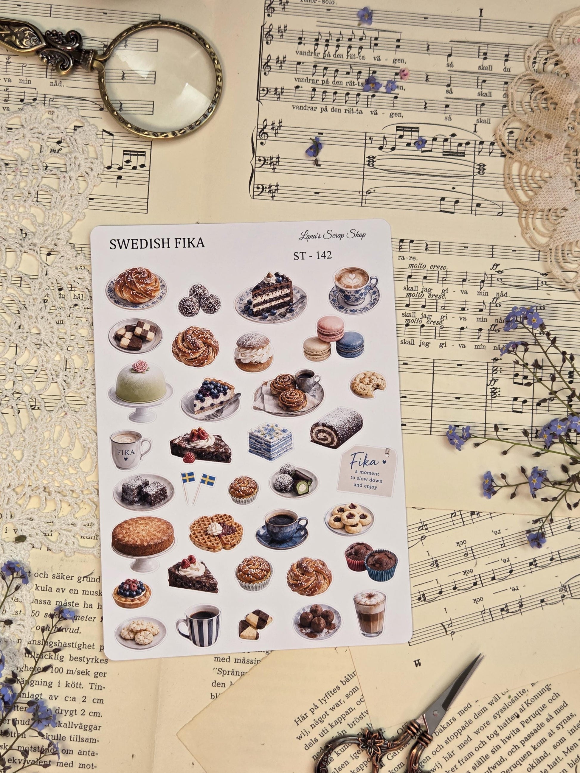 Scandinavian-inspired sticker sheet with cozy fika moments, coffee cups, cinnamon buns, Swedish desserts, blueberries, flowers, and soft blue neutral tones for journaling and scrapbooking.
