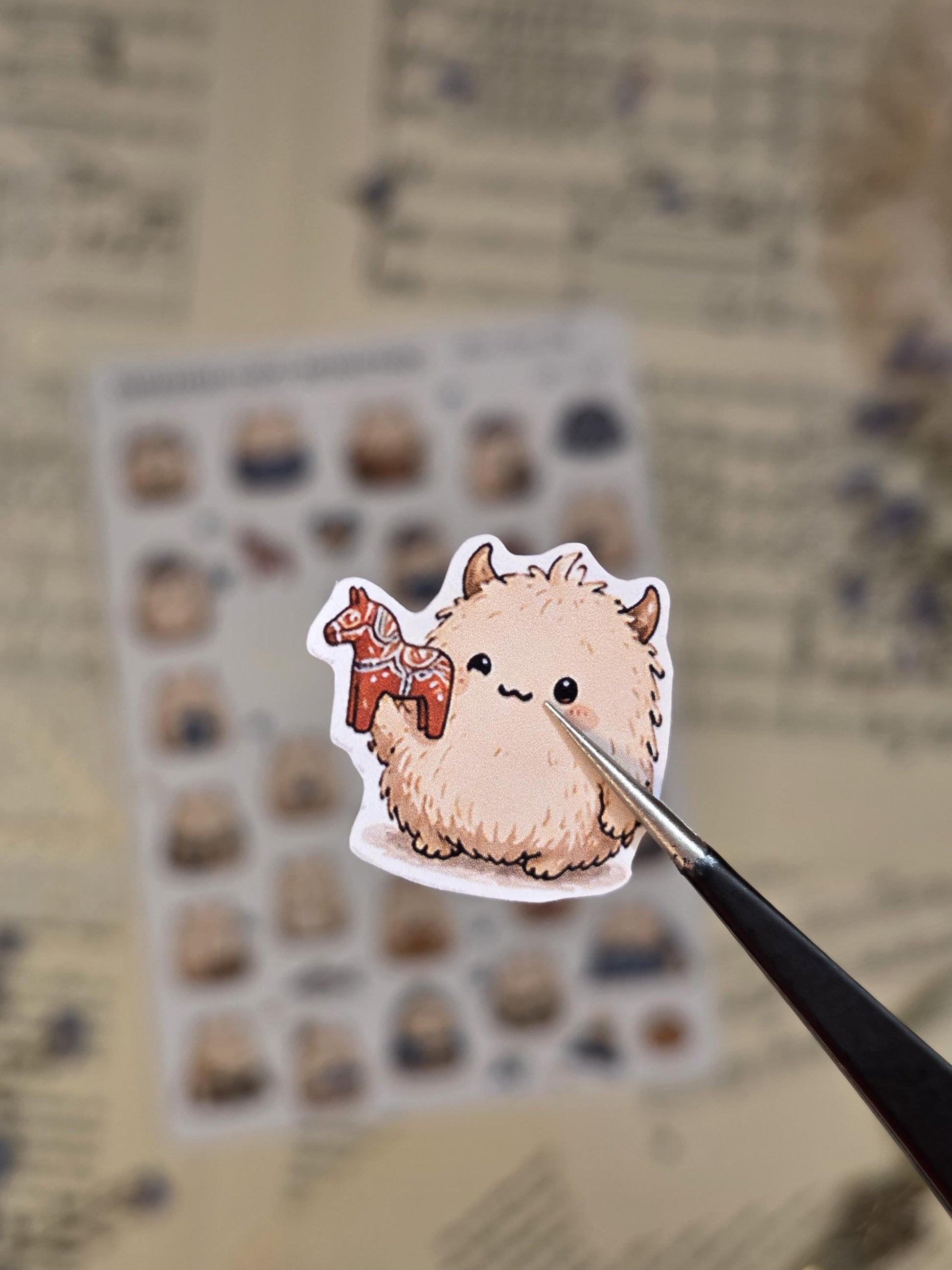 Scandinavian cozy monster sticker sheet featuring kawaii fluffy creatures, fika moments, blueberries, knitted sweaters, books, and cute Nordic lifestyle elements.