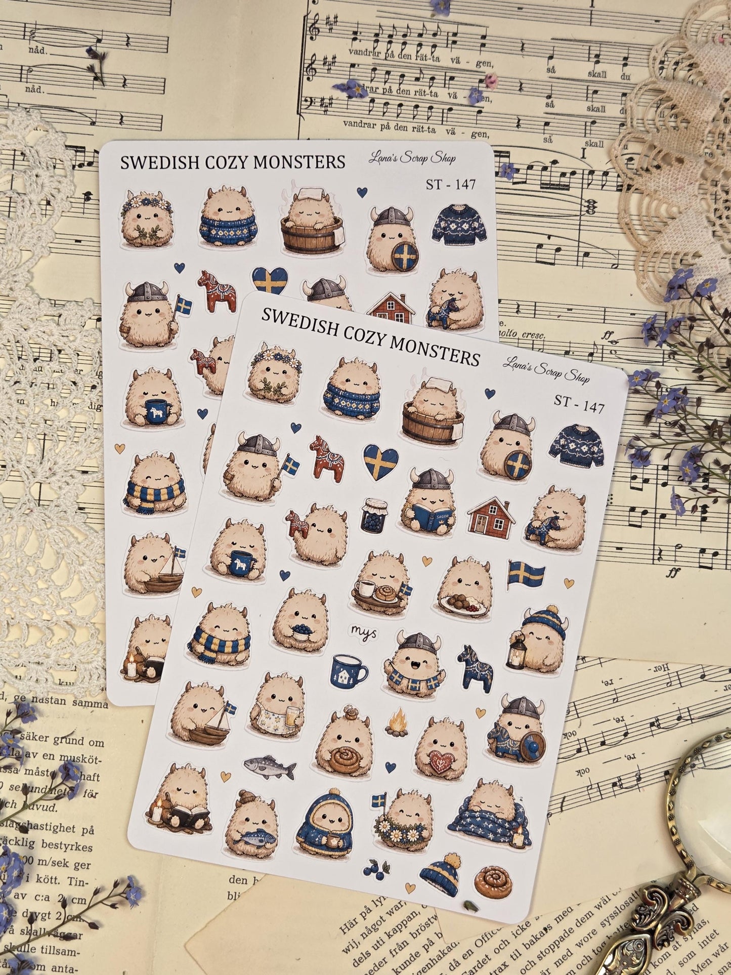 Cute Scandinavian monster sticker sheet with fluffy cozy creatures, Viking helmets, Swedish flags, dala horses, cinnamon buns, and soft Nordic winter details for journaling.
