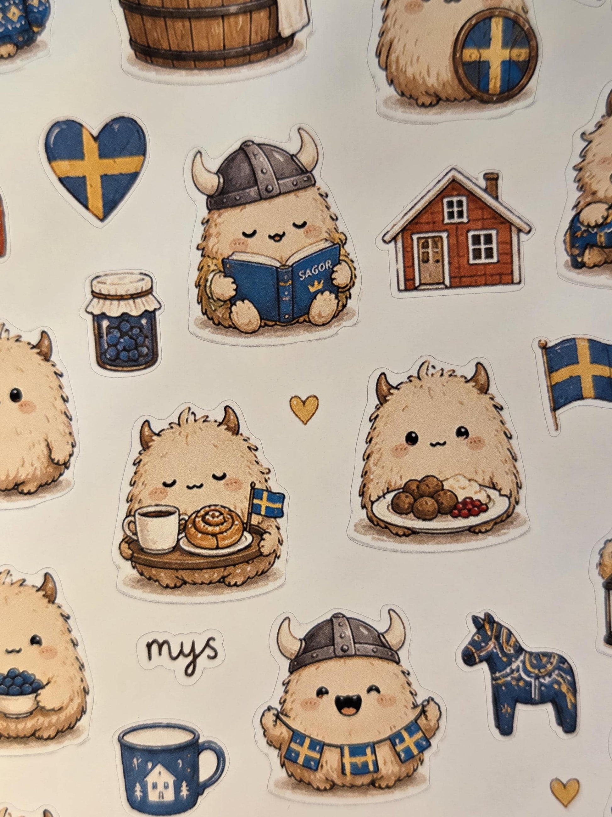 Nordic-inspired cute monster stickers with warm beige fluffy characters, Viking details, Swedish symbols, cozy winter accessories, and hygge journaling aesthetics.
